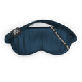 Blue sleep mask with brown strap on a white background